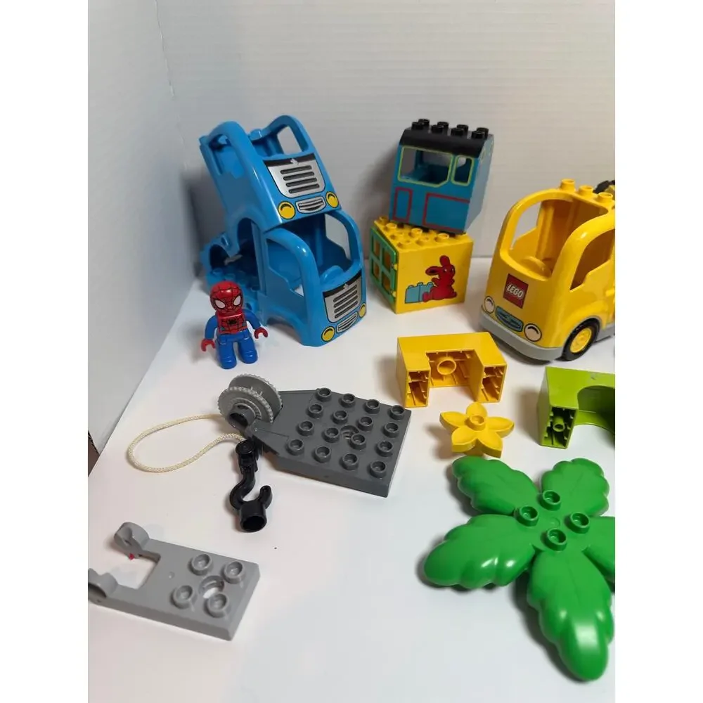 Lot of 21 Lego duplo pieces incl Spiderman figure and police officer accessories